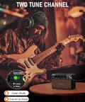 Musician playing electric guitar with Compact 10W Guitar Amp With Clean And Drive Channel USB C Rechargeable Wireless Portable Practice Amp nearby.