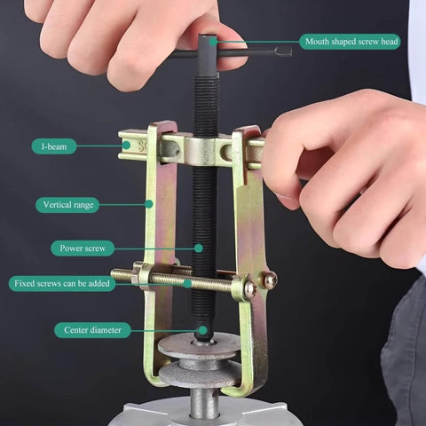 Close-up of a Two Jaw Gear Puller Four Inch Adjustable Gear Bearing And Pulley Removal Tool in use, showing screw details.
