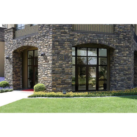 Building exterior with XTOR1B Cross Tour Carbon Bronze 12W Low Profile Small Housing Outdoor Integrated LED Wall Pack Light