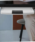 Under Desk Keyboard Tray With Slick Glide Mechanism And Ergonomic Wrist Rest For Smooth Typing Sessions shown mounted under a desk.