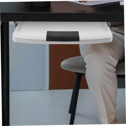 Under Desk Keyboard Tray With Slick Glide Mechanism And Ergonomic Wrist Rest For Smooth Typing Sessions shown mounted under a desk.