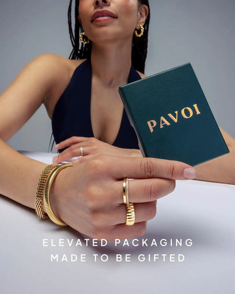 Go To 3mm Ball Stud Earrings With Flatback Disc, 925 Silver Post, 14K Gold Plated Yellow Gold Finish For Everyday Wear, Comfortable All Day And Night, Screw In Flatback Design, Durable And Bright. woman wearing gold hoop earrings and holding Pavoi gift box