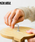 Person using an Allen wrench to assemble wooden furniture, demonstrating tool use from the 185 Piece Tool Set With General Household Hand Tool Kit