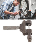 Mechanic using Universal Chain Breaker Tool for 420 to 530 Roller Chains, Heavy Duty Steel Kit for motorcycle maintenance.