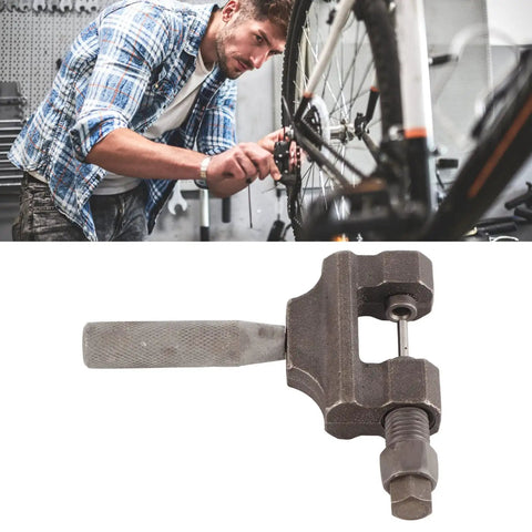 Mechanic using Universal Chain Breaker Tool for 420 to 530 Roller Chains, Heavy Duty Steel Kit for motorcycle maintenance.