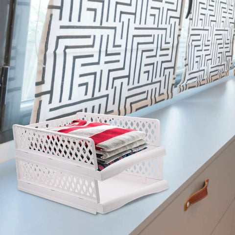 Sick Plastic Drawer Storage Baskets For Closets And Bedrooms That Stack Crisp on a countertop holding folded towels.
