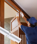 Heavy Duty Dual Spring Bifold Door Slide Guides Two Pack forged from rock solid ABS plastic, shown during installation on a closet door.