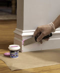 Applying Professional Grade DryDex Wood Filler Goes On Hella Smooth And Sands Just Like Real Wood to corner with a putty knife.
