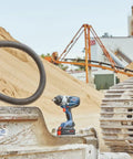 Heavy Duty 18 Volt Cordless Impact Wrench With Half Inch Drive Friction Ring and Beast Mode Torque for Stubborn Bolts at a construction site.