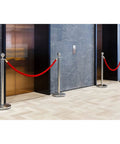 Red Velvet Stanchion Rope Set With Gold Stanchions For Elegant Crowd Control in front of elevators, seamless line dividers.