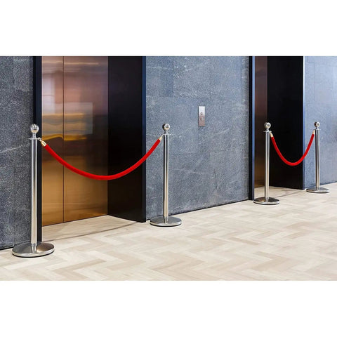 Red Velvet Stanchion Rope Set With Gold Stanchions For Elegant Crowd Control in front of elevators, seamless line dividers.