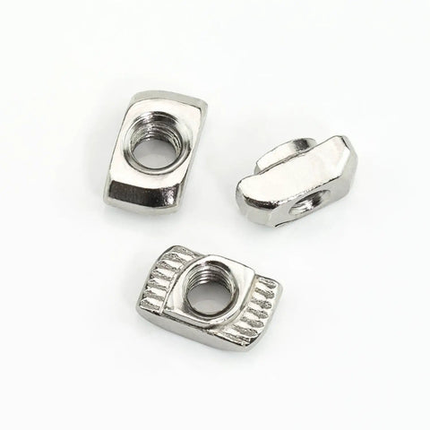 Three nickel-plated T-slot nuts from 160 Piece Hammer Head T Slot Nut Kit For Aluminum Profiles M3 M4 M5 Drop In Nuts Built Tough
