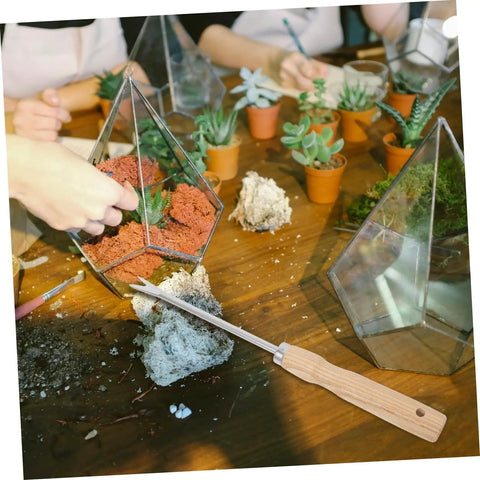 Ergonomic Wooden Handle Weed Puller Tool For Gardeners Lightweight Weeding Tool displayed with terrarium planting scene