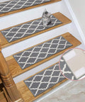 Cat near gray stair treads attached with stick on 2x4 inch hook and loop tape set 12 sets no holes or screws sticky back fastener