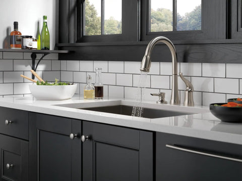 Rugged Brushed Nickel Kitchen Faucet With Butter Smooth Pull Down Spray And Built In Soap Dispenser Quick Fit Zero Sweat Two Hole Mount Single Handle Sink Fixture Leak Tight Seal Guard For Everyday Life Prep displayed over a modern black kitchen sink.
