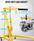 Heavy Duty Bad Boy Hydraulic Shop Crane Doubles As An Engine Hoist with adjustable load positions and engine attached.