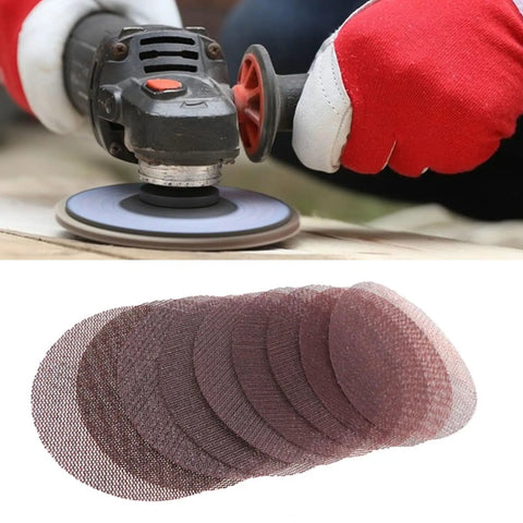 Premium 50 Pack Mesh Sanding Discs With Hook And Loop Backing For Drywall Plus Wood And Metal, Dust Free Grit Design Clogs Less And Lasts Longer To Crush It On Any Tough Job Without The Mess, shown in use with a sander.