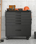 Heavy Duty Rolling Tool Chest With Six Full Extension Drawers And Whisper Quiet Tracks, Easy Glide Wheels Make Tackling Garage Grunt Work A Breeze, Rust Resistant Steel Organizer Built Tough For Real Jobs, side view with tools on top.