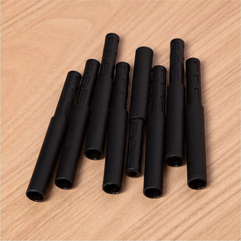 8 Pack Golf Club Shaft Extensions Carbon Fiber 0.49 Inch Small End 0.595 Inch Thick End By 3 Inch Length Black on Wood Surface