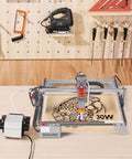 VEVOR air assist kit installed on laser engraver; 30 L/min airflow with external pump and tubing.