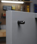 A close-up of a cabinet with a carbon steel peg from a 24 Piece Shelf Peg Set For Cabinets And Cupboards With Rubber Caps, Carbon Steel Pins For Easy, Stable Adjustments And No Wobble Storage In Kitchen, Wardrobe, Bookcase, And Home Organization inserted in a side panel.