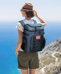 Soft Lightweight Leakproof Backpack Cooler For 35 Cans, Insulated Bag being worn by a hiker overlooking a coastal landscape