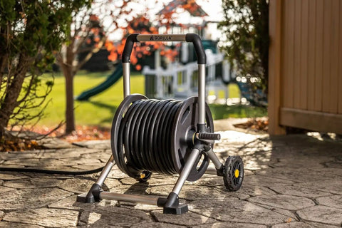 200 Foot Heavy Duty Aluminum Upright Hose Reel With Rust Proof Frame Leak Proof Brass Connections in garden setting