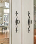 Vintage Style Antique Bronze Long Cabinet Handles 6.3 Inches, 2 Pack Hollow Drawer Pulls installed on white cabinet doors