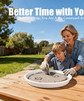 Mother and son using Round Stepping Stone Molds 4 Pack For Concrete, 10.2 Inch Diameter And 1.18 Inch Deep in garden setting.