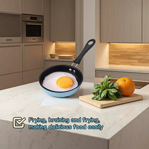 4.7 Inch Mini Nonstick Egg Pan With 5 Layer Coating on countertop with cooked egg, ideal for camping and RV kitchens