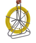 6mm 130m Fiberglass Fish Tape With Steel Reel Stand And Brake, 425ft Wire Pulling Rod for Electrical Ducts held in hand.