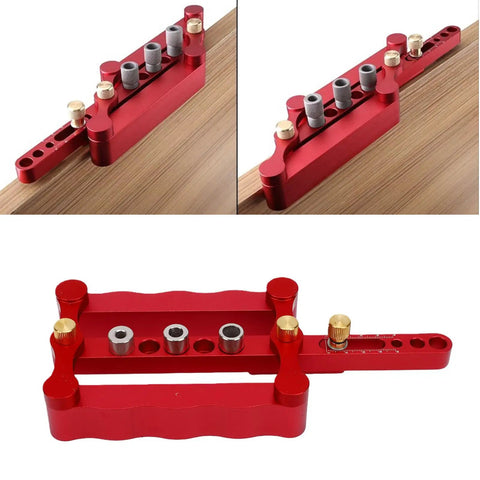 Dead On Precision Complete Self Centering Doweling Jig Kit With Professional Drill Bushes viewed from top with gray drill bushes on red aluminum base.