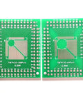 Two green PCBs from Five Pack QFP To DIP Pin Adapter Socket Kit For QFP 32 44 48 64 1000 Pin To DIP PCB Proto Converter