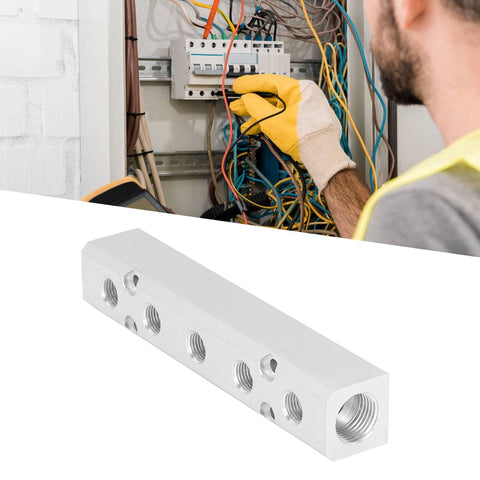 Pneumatic Manifold Air Distribution Block Made From Aluminum Alloy for Air Compressors, against electrical panel background