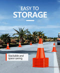 12 Pack 18 Inch Traffic Safety Cones With Reflective Collars, Durable PVC Construction, Orange Cones stacked on road, palm trees