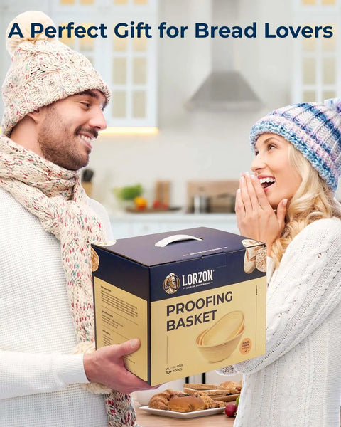 Couple exchanging All-In-One Sourdough Starter Kit With Silicone Proofing Baskets And Jar in cozy kitchen setting.
