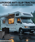 Heavy Duty RV Camper Leveling Blocks 12 Pack With Interlocking Stabilizer Jack Pads For Trailer Rig Ground Support Hella Sweet Campout Setup Gear In Durable Gray near a white RV on wet terrain.