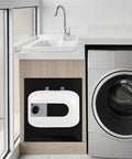 Slick Electric Mini-Tank Water Heater with Totally Sick Instant Hot Water on Tap installed under sink beside washer.