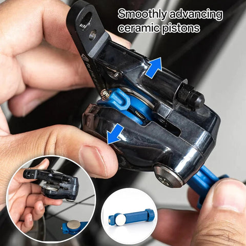 VONMAOGU bicycle hydraulic disc brake piston reset tool; blue caliper spreader in use on disc brake caliper