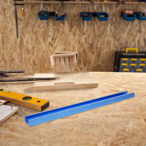 Multifunctional Aluminum T Track Slot Guide For Woodworking on workshop table with tools in background