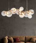 Top Tier Oval Glass Pendant Ceiling Lamp Featuring Postmodern Lighting Design for bright indoor decor above a modern couch.