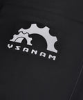 Close-up of a black 10L Roll Top Bike Saddle Bag with logo showcasing the waterproof PVC TPU construction.