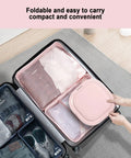 No Sweat Compact Washer And Dryer Combo With Foldable Stand and Smart Touchscreen Controls in a suitcase, showcasing convenience for travel.