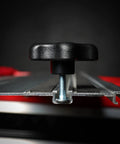 Side view of 5/16 Inch Threaded Knob Kit With Bolts And Washers in T-track system on a red surface, showing knob and bolt inserted.