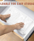 Hands folding 2 Pack Leggings And Shirt Organizer With 24 Compartments, Space Saving Hanging Closet Organizer, white finish, easy storage