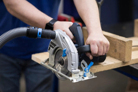 Quick Click 16 Foot Commercial Vacuum Hose with Expanded Multi Brand Power Tool Adapter Set connected to a circular saw