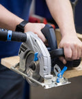 Close-up of a power saw cutting wood connected to Quick Click Dust Separator With 5 Gallon Locking Collection Bin And Power Tool Adapter Set With 16 Ft Hose For Easy Dust Debris Separation From Your Shop Keeping Vacuums Cleaner And Clogs Down