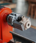 NCK Series Quick Change Woodturning Lathe Jaws for Pipe and Spoon Making attached to lathe with a wood piece