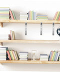 4 Pack Heavy Duty Right Angle Shelf Brackets Outside Corner Wall Mounts in silver supporting books on wooden shelves.