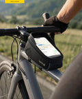 Cyclist using Waterproof Bike Frame Bag With 1.6L Capacity Front Phone Holder And Touchscreen Window Rain Cover Cycling Pouch For 7 Inch Phones Easy Access Bike Accessory For Commuting Or Trail Rides On The Go
